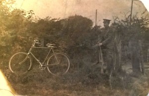 John Unwin photo in uniform with bicycle